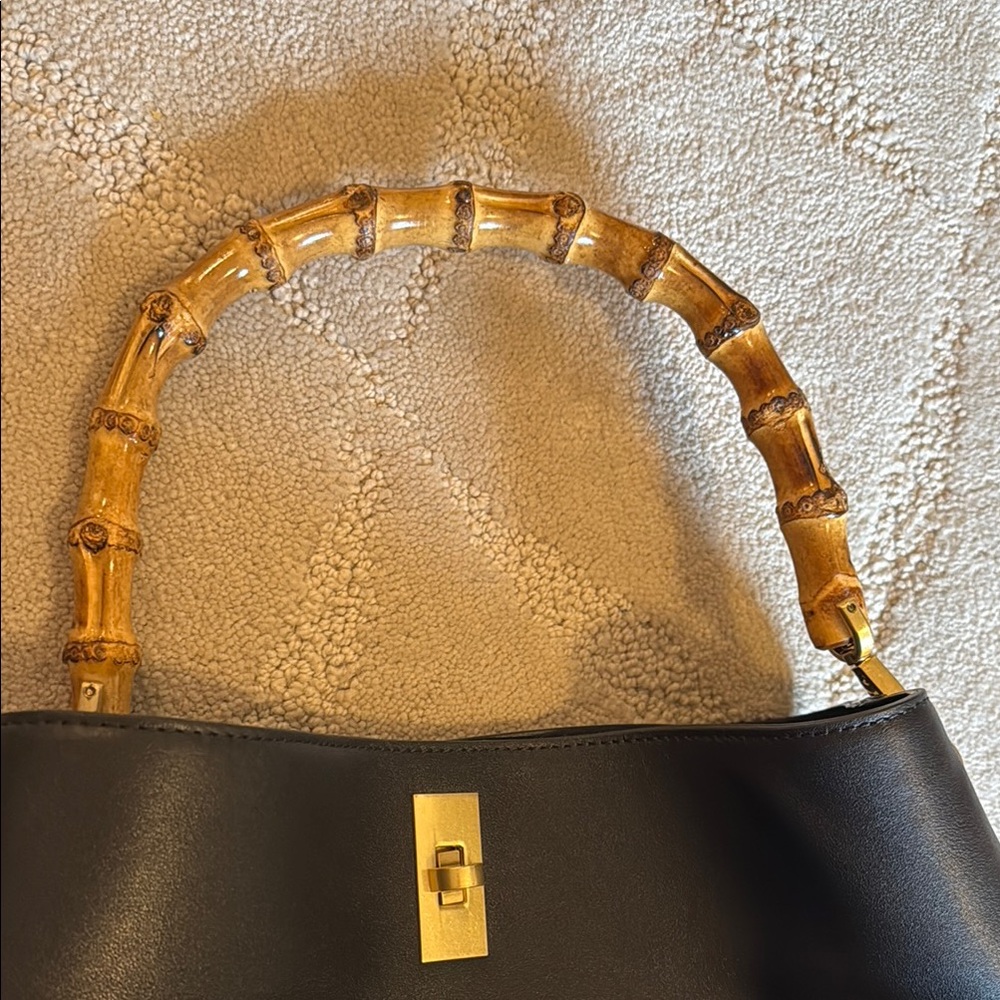 NWT black leather bag with bamboo OR exchangeable strap. Blue dust bag only